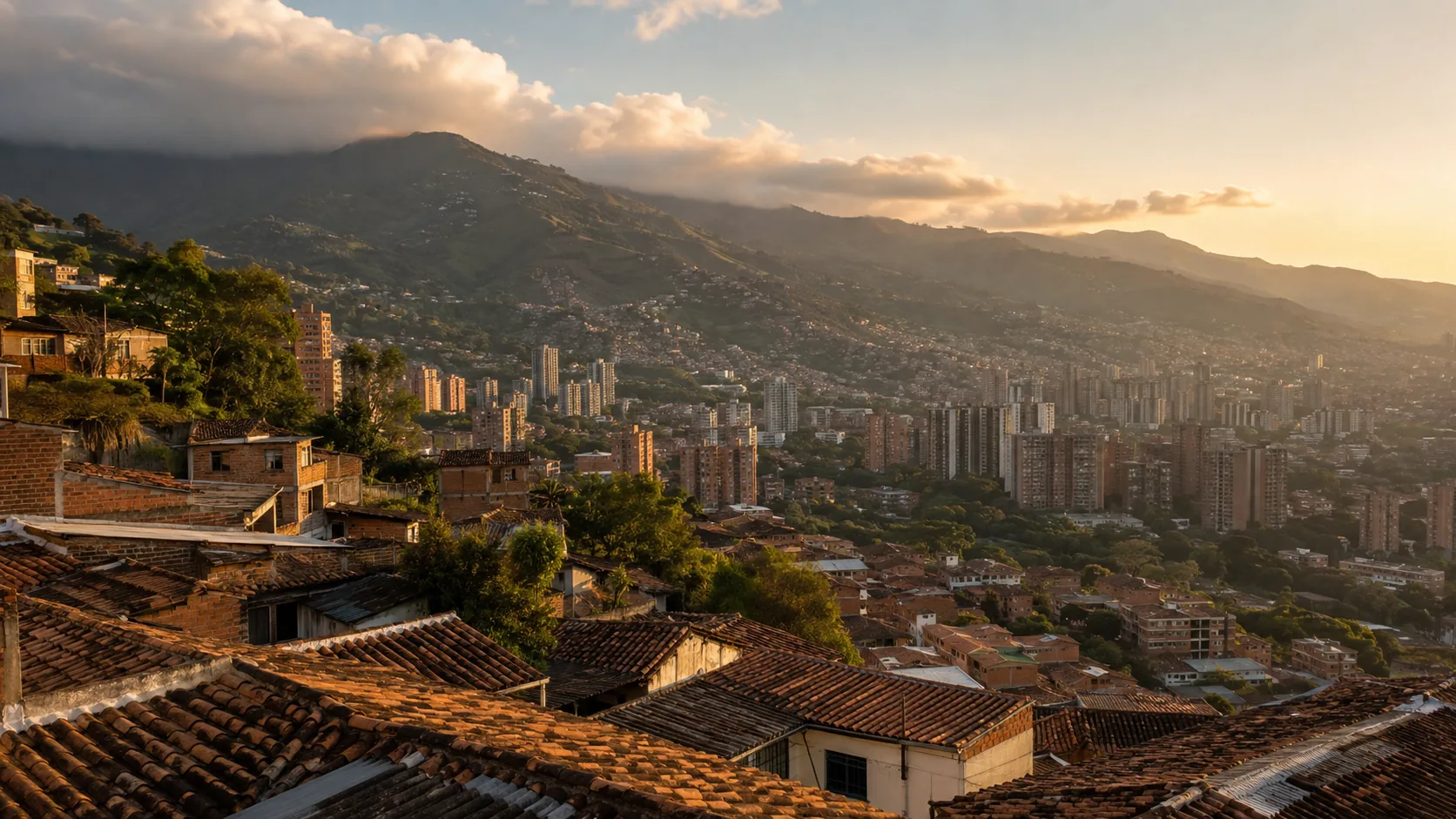 Medellin at sunset seen from a hillside of tiled rooftops